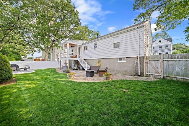 359 Corey St, Boston, MA 02132 - back of property with a patio area, stairway, and a gate