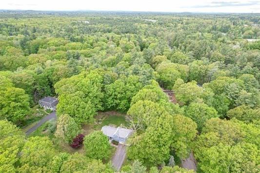 5 Plouff Ln, Exeter, NH 03833 - aerial overview of property's location with a heavily wooded area
