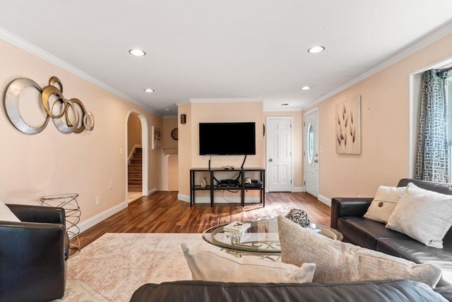 5 Plouff Ln, Exeter, NH 03833 - living area with arched walkways, recessed lighting, wood finished floors, crown molding, and baseboards