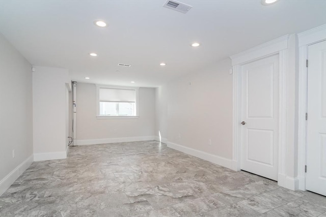 unfurnished room featuring recessed lighting, visible vents, and baseboards