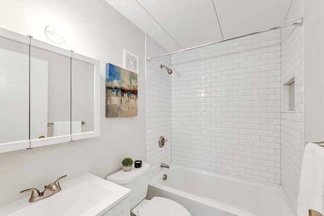 bathroom with toilet, vanity, visible vents, and shower / bathing tub combination