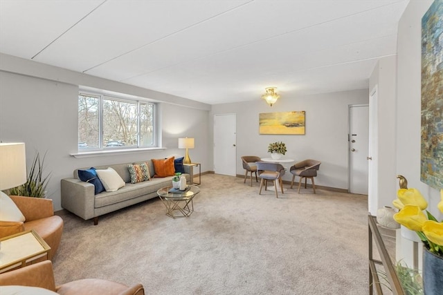 living room with baseboards and carpet flooring