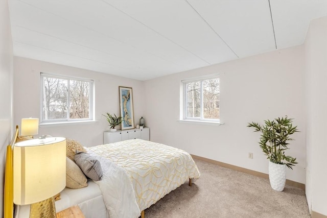 bedroom with carpet floors and baseboards