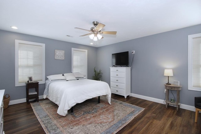 bedroom featuring dark wood-type flooring and ceiling fan