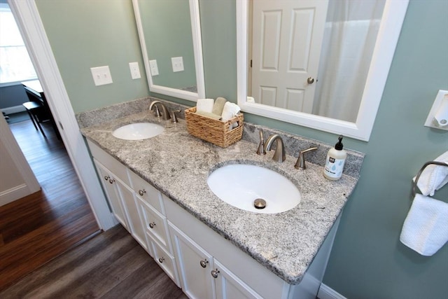 bathroom with vanity and hardwood / wood-style floors