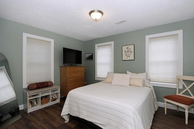 bedroom featuring dark wood-type flooring