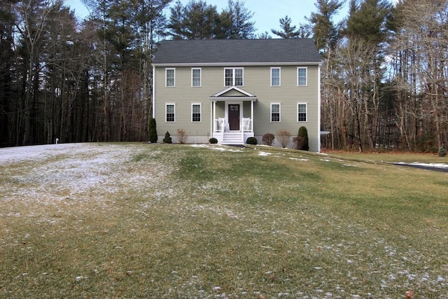 colonial home with a front yard