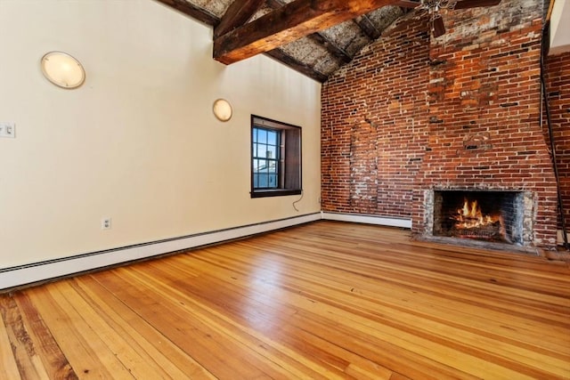 unfurnished living room featuring a fireplace, hardwood / wood-style flooring, baseboard heating, high vaulted ceiling, and beamed ceiling