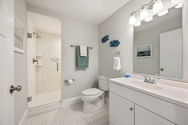 full bath with baseboards, a shower stall, toilet, and vanity