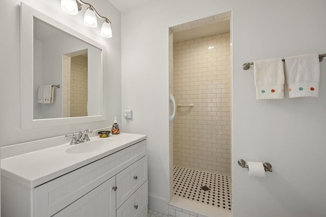 full bath featuring a stall shower and vanity