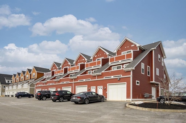 exterior space with a garage and a residential view