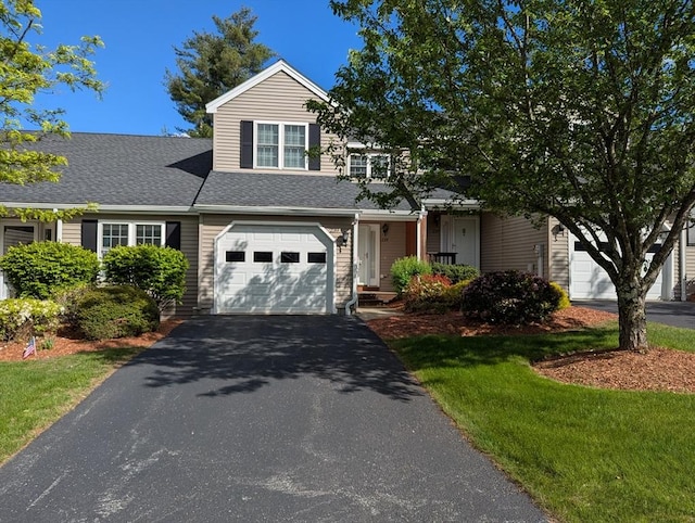 239 Bridle Cross Rd Unit 239, Fitchburg, MA 01420 - view of front of house with asphalt driveway, a shingled roof, and an attached garage