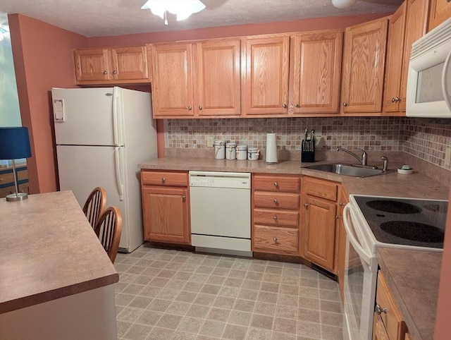 239 Bridle Cross Rd Unit 239, Fitchburg, MA 01420 - kitchen with white appliances, a sink, backsplash, and light floors