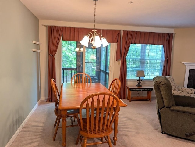 239 Bridle Cross Rd Unit 239, Fitchburg, MA 01420 - dining space featuring a chandelier, light carpet, and baseboards