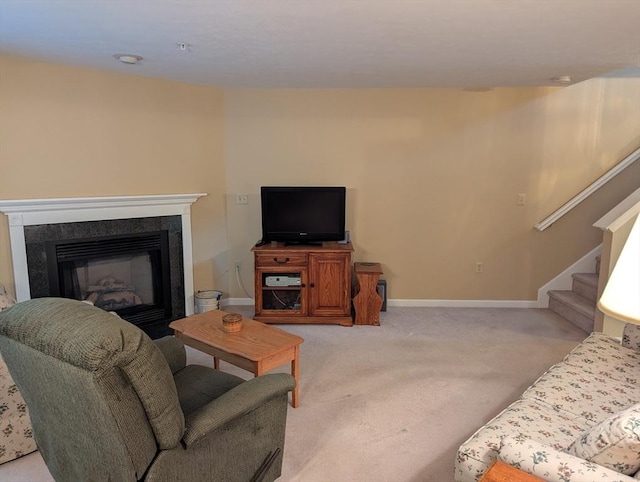 239 Bridle Cross Rd Unit 239, Fitchburg, MA 01420 - living room with light colored carpet, baseboards, stairway, and a glass covered fireplace