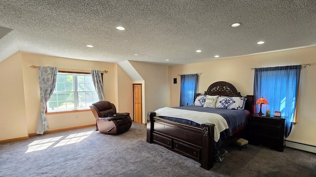 bedroom featuring a textured ceiling, carpet flooring, and baseboard heating