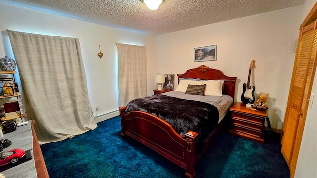 carpeted bedroom with a textured ceiling, baseboard heating, and a closet