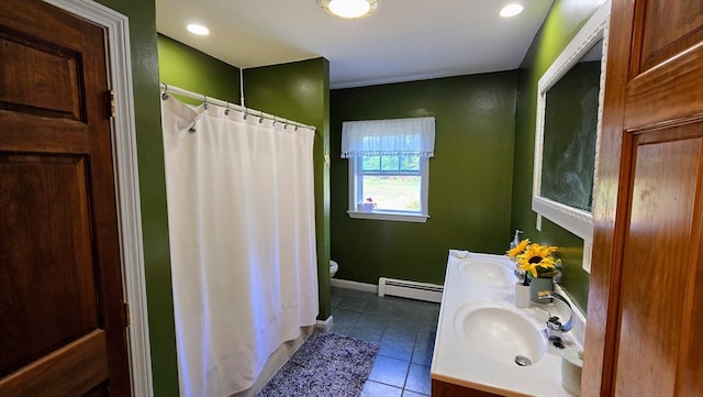 bathroom featuring toilet, baseboard heating, tile patterned floors, vanity, and curtained shower