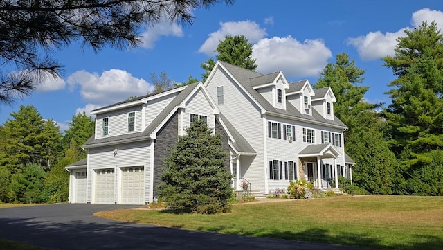 view of front of house with a front lawn and a garage