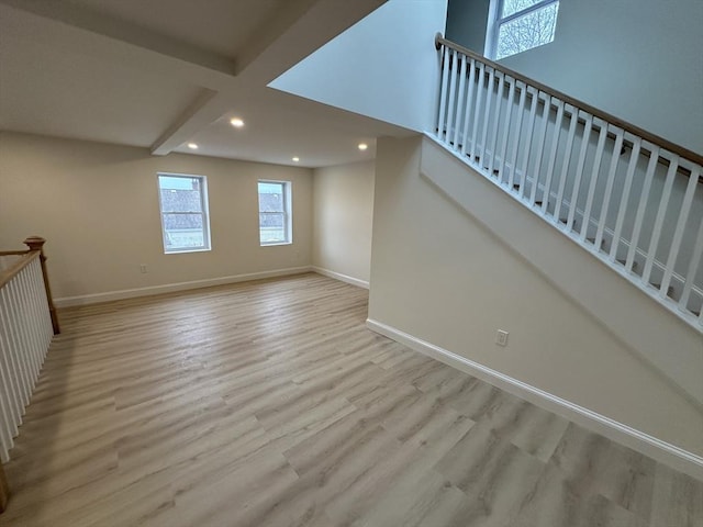 interior space featuring hardwood / wood-style flooring and beam ceiling