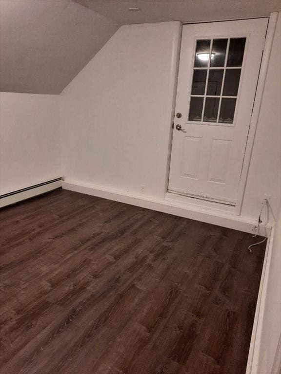 bonus room featuring vaulted ceiling, dark hardwood / wood-style floors, and baseboard heating