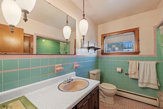 full bath featuring tile walls, vanity, toilet, tile patterned flooring, and a baseboard radiator