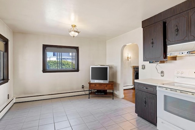 kitchen with arched walkways, electric range, under cabinet range hood, light countertops, and baseboard heating