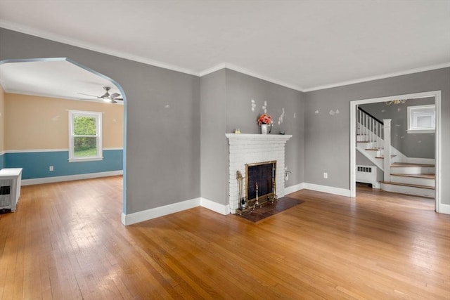 229 May St, Worcester, MA 01602 - unfurnished living room with radiator heating unit, hardwood / wood-style floors, stairs, baseboards, and ceiling fan