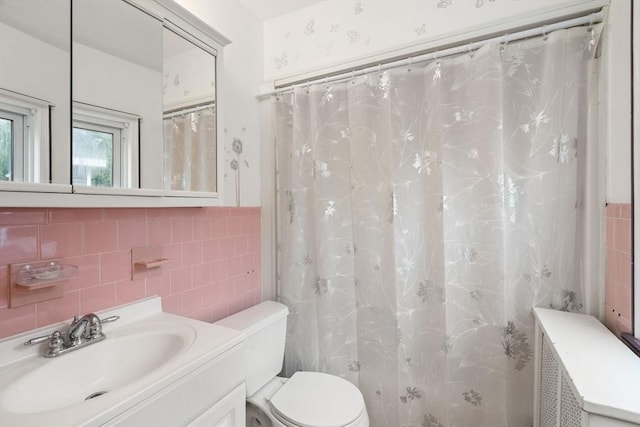 229 May St, Worcester, MA 01602 - full bathroom with tile walls, toilet, vanity, and curtained shower