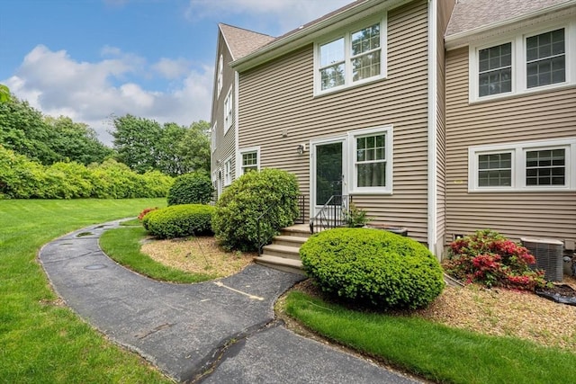 7 Hovey Pond Dr Unit 7, Grafton, MA 01536 - view of side of property featuring central air condition unit and a yard