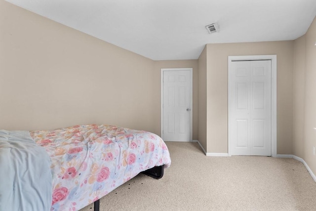 7 Hovey Pond Dr Unit 7, Grafton, MA 01536 - bedroom featuring light carpet, baseboards, and a closet