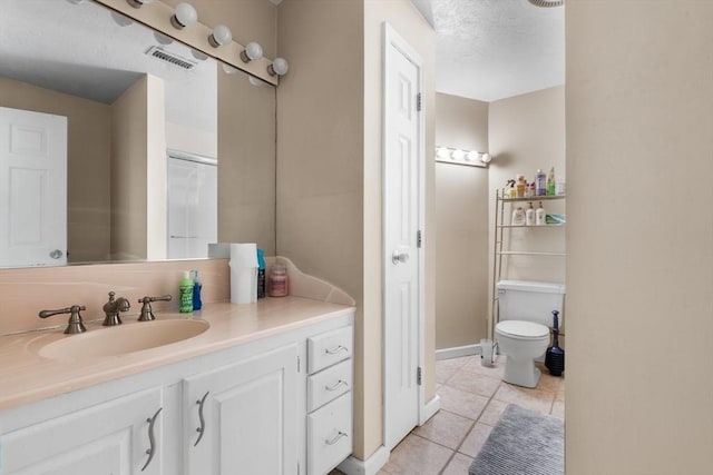 7 Hovey Pond Dr Unit 7, Grafton, MA 01536 - bathroom featuring tile patterned flooring, vanity, toilet, and baseboards