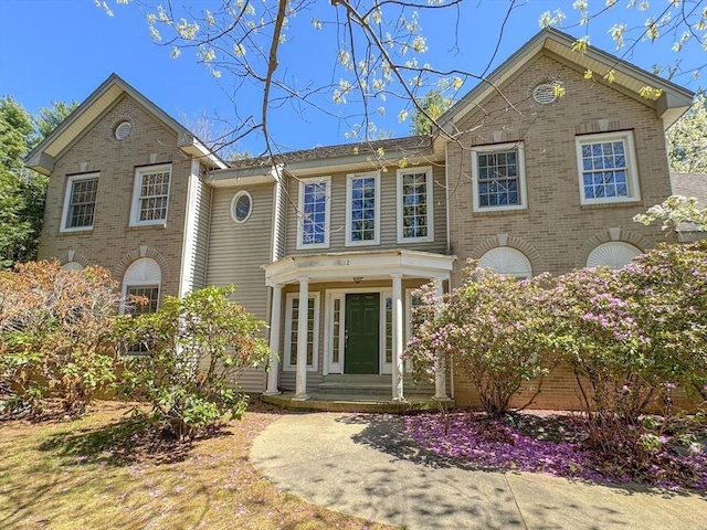 view of front of home featuring brick siding