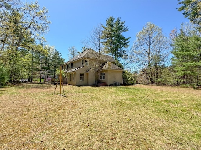 view of side of property with a yard