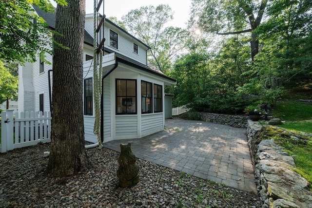 74 Dedham St, Newton, MA 02461 - rear view of house with a patio