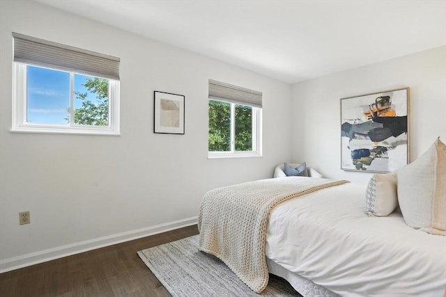 109 Governor Winthrop Rd Unit 109, Somerville, MA 02145 - bedroom with dark wood finished floors and baseboards