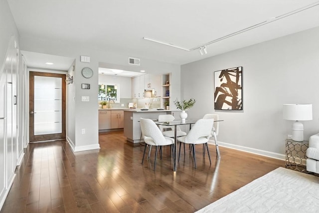 109 Governor Winthrop Rd Unit 109, Somerville, MA 02145 - dining room with dark wood-style flooring