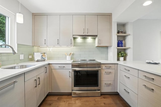 109 Governor Winthrop Rd Unit 109, Somerville, MA 02145 - kitchen with stainless steel electric range oven, open shelves, dark wood-type flooring, light countertops, and backsplash