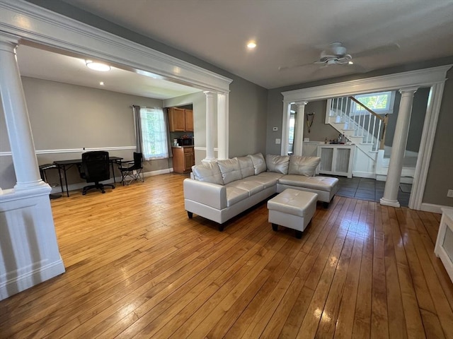 14 Waldo Ct, Haverhill, MA 01835 - living area with ornate columns, light wood-style flooring, an office area, stairway, and recessed lighting
