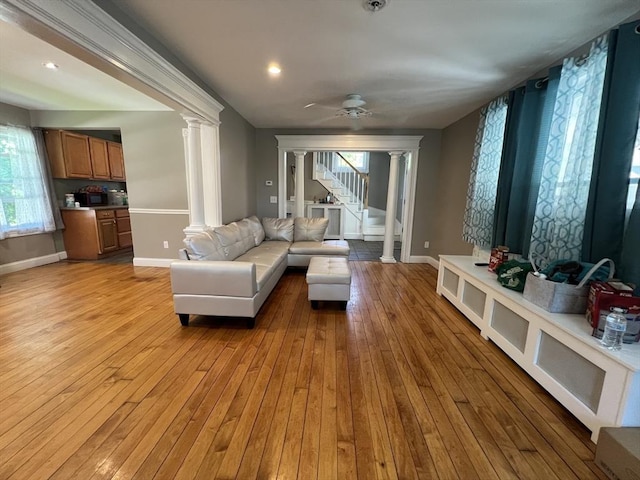 14 Waldo Ct, Haverhill, MA 01835 - living room with decorative columns, plenty of natural light, light wood finished floors, stairs, and recessed lighting