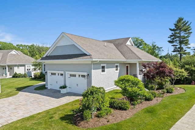 31 Chittenden Ln Unit 31, Cohasset, MA 02025 - view of side of home with a garage, a yard, roof with shingles, and decorative driveway