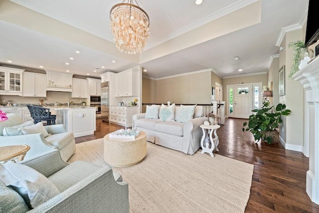 31 Chittenden Ln Unit 31, Cohasset, MA 02025 - living area with dark wood finished floors, recessed lighting, a chandelier, and crown molding