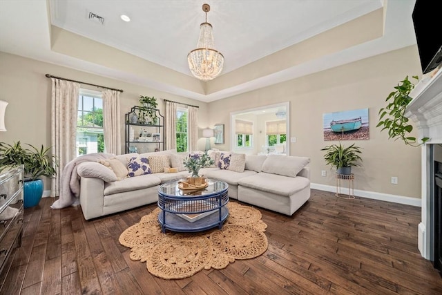 31 Chittenden Ln Unit 31, Cohasset, MA 02025 - living room with a raised ceiling, dark wood-style floors, a chandelier, and ornamental molding