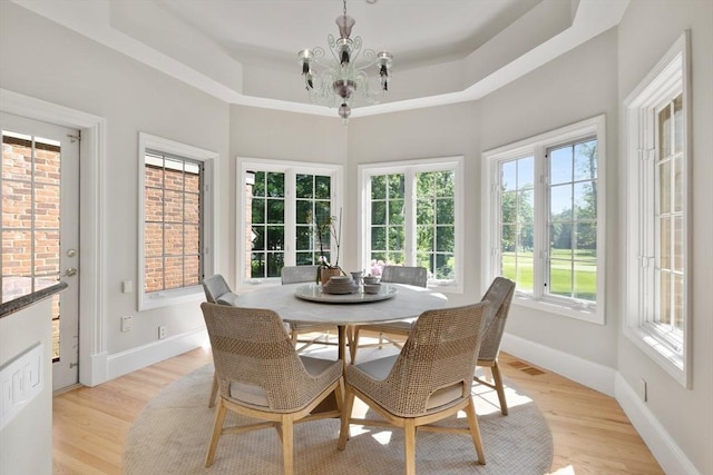 11 Fairway Dr, Andover, MA 01810 - dining room featuring a chandelier, light wood finished floors, and a tray ceiling