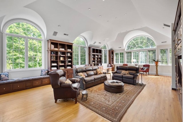 11 Fairway Dr, Andover, MA 01810 - living room with vaulted ceiling, healthy amount of natural light, and light wood finished floors