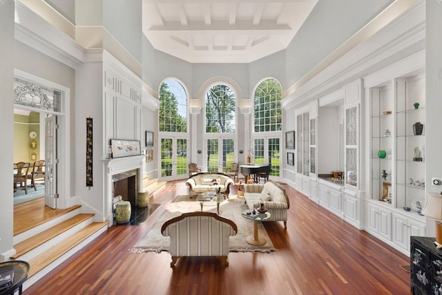 11 Fairway Dr, Andover, MA 01810 - living room with a high ceiling, a fireplace with flush hearth, wood finished floors, and built in features