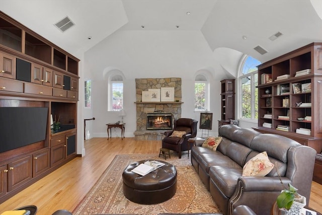 11 Fairway Dr, Andover, MA 01810 - living room featuring high vaulted ceiling, light wood-type flooring, and a fireplace