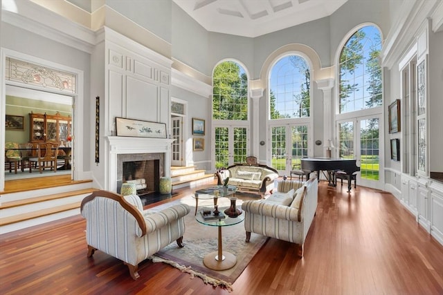 11 Fairway Dr, Andover, MA 01810 - living area featuring a towering ceiling, wood finished floors, and a fireplace with flush hearth