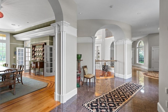 11 Fairway Dr, Andover, MA 01810 - foyer entrance featuring decorative columns, arched walkways, granite floors, healthy amount of natural light, and recessed lighting