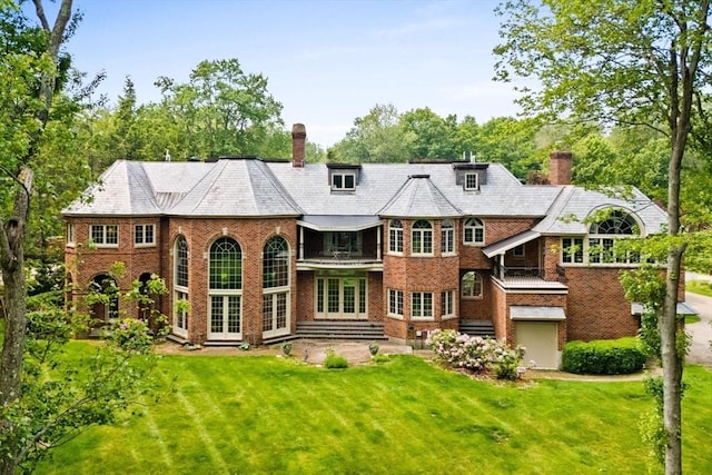 11 Fairway Dr, Andover, MA 01810 - back of property with french doors, a chimney, a lawn, and a balcony